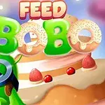 En tegnet grønn karakter med briller foran en stor kake med jordbær og teksten FEED BOBO