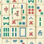 Et mønster av forskjellige fliser med kinesiske symboler i rødt, grønt, og blått på en beige bakgrunn