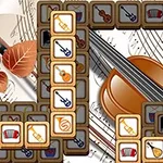 Fliser med bilder av musikkinstrumenter som fiolin, gitar og trompet, arrangert over et bakgrunnsmotiv av noter og en fiolin