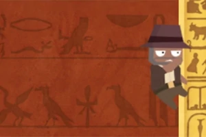 En tegnet figur med hatt klatrer på en vegg dekorert med egyptiske hieroglyfer