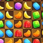 Fargerike geometriske former, inkludert bananer, gelé, og pastiller, er arrangert i et rutemønster på en brun bakgrunn